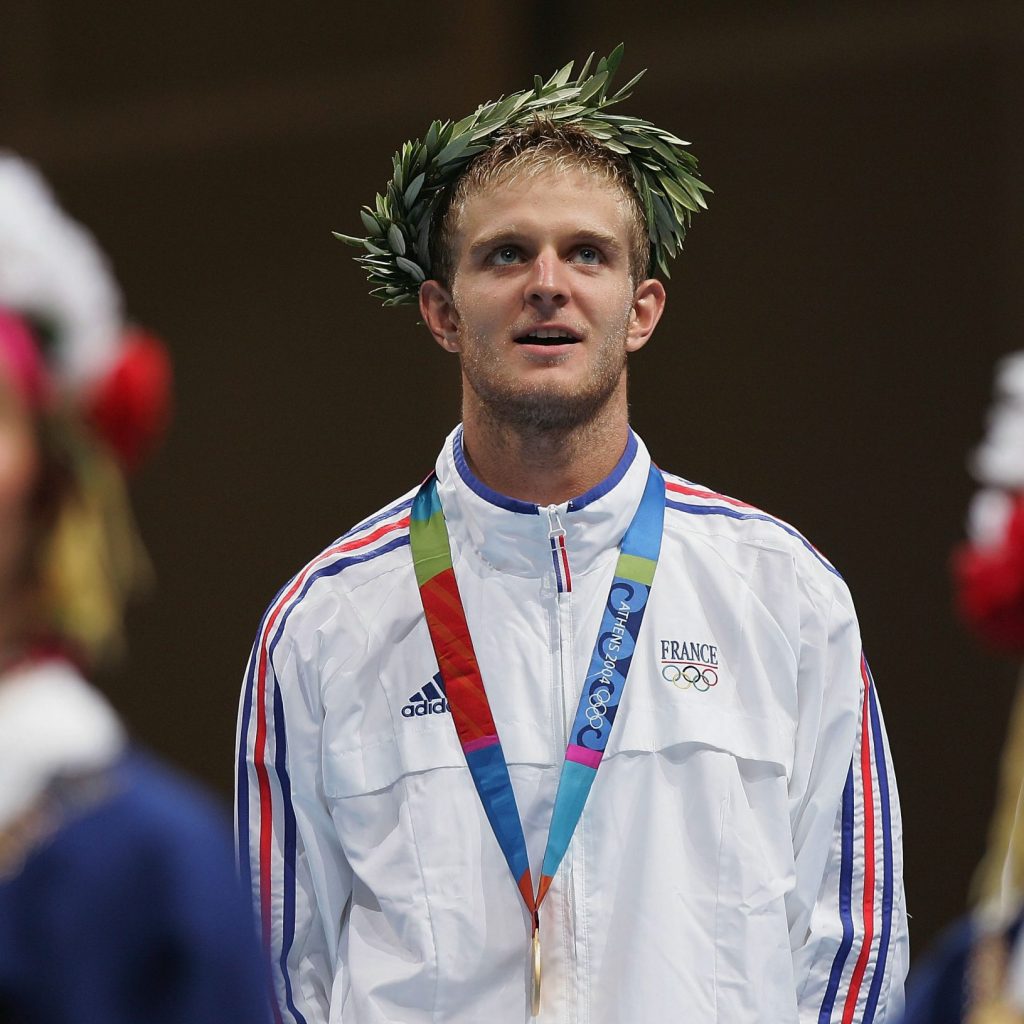ATHENS - AUGUST 16:  Brice Guyart of France receives the medal for the men's fencing individual foil event on August 16, 2004 during the Athens 2004 Summer Olympic Games at Helliniko Olympic Complex Fencing Hall in Athens, Greece. (Photo by Stuart Franklin/Getty Images).